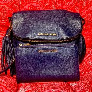 Michael Kors purse with matching wallet.